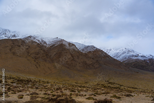 snow covered mountains, cloudy sky at the way from Moriri lake to Leh city, Ladakh, India