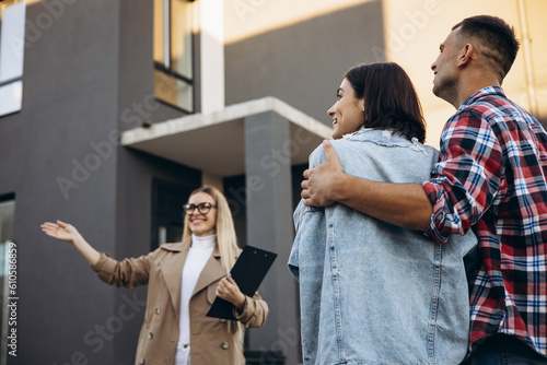 Young family with realtor looking for a new house