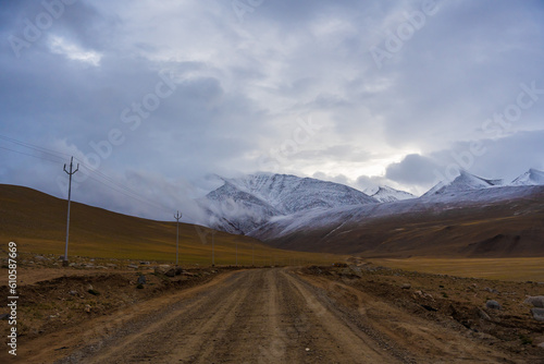 the road and snow covered mountains, beautiful scenery in the Himalayas at Ladakh, India