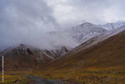 snow covered mountains, cloudy sky at the way from Moriri lake to Leh city, Ladakh, India