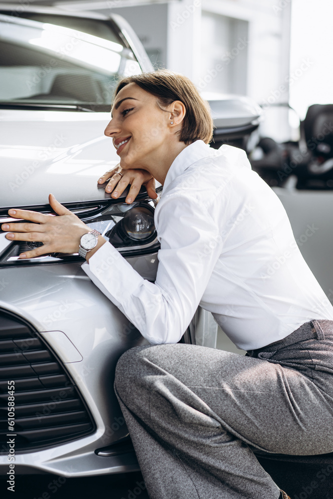 Beautiful woman hugging a car Beautiful woman hugging a car