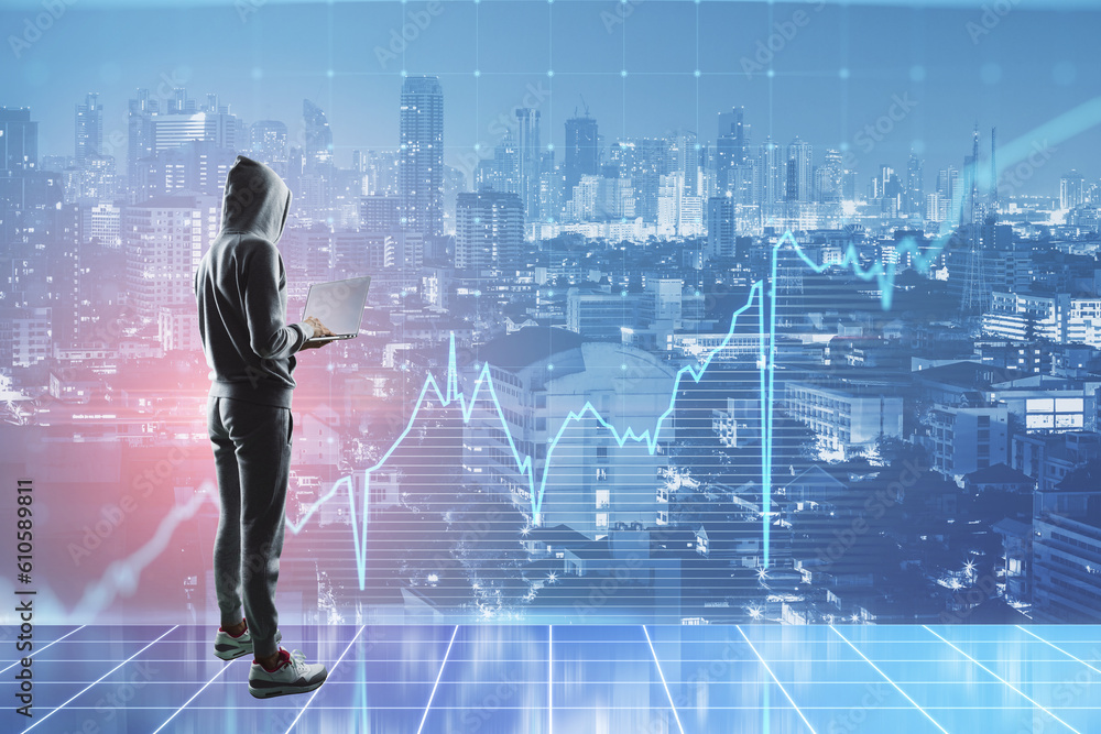 Hacker with laptop standing on abstract toned city background with business grid chart. Finance and data theft concept. Double exposure. Hacker with laptop standing on abstract toned city background with business grid chart. Finance and data theft concept. Double exposure.