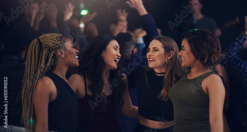 Music, party and night with women in club for dance, celebration and nightlife concert. Festival, disco and happy hour with friends dancing in crowd at social event for energy, techno and dj show