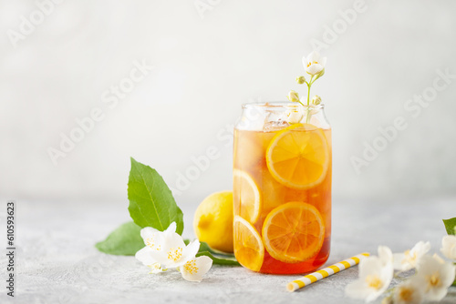 Lemon jasmine iced tea in a glass  on a gray background