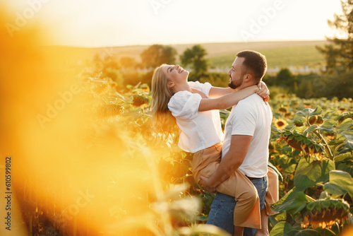 People spend time in a sunflowers field