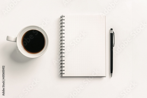 Cup of coffee and notebook on a desk