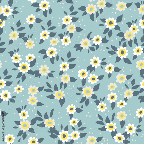 Seamless pattern of a blooming summer meadow. A repeating floral pattern on a light green background. There are many different white flowers with yellow inflorescences on the field