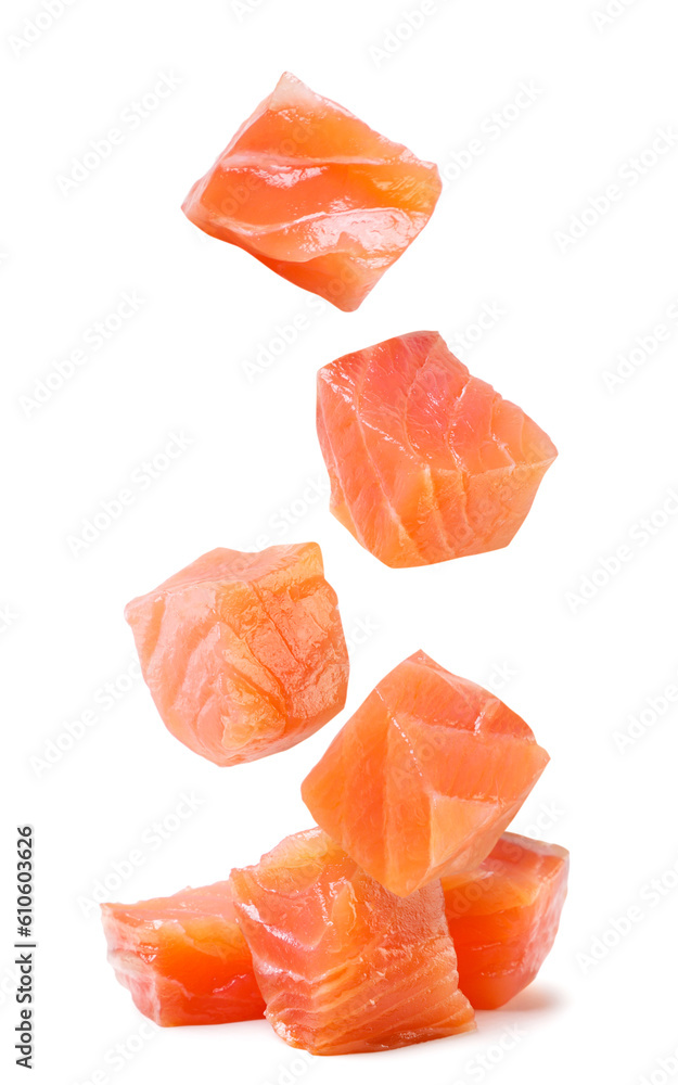 Trout cubes fall on a pile on a white background. Isolated Trout cubes fall on a pile on a white background. Isolated