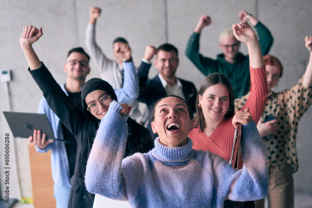Fototapeta premium A diverse group of successful businessmen raises their hands in the air, symbolizing achievement, accomplishment, and the fulfillment of goals, exuding confidence, unity, and celebration of their