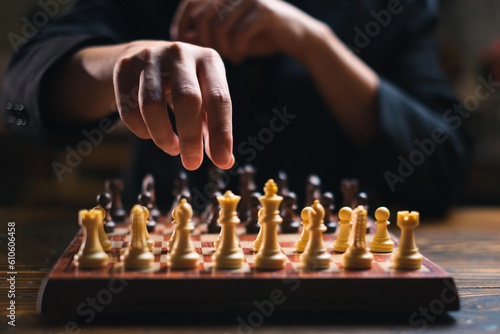 Hand playing a chess board game. Concept of business strategy, planning, Success, leadership, victory, challenge. Smart and powerful move. Thinking, marketing, management team and achievement tactic. 