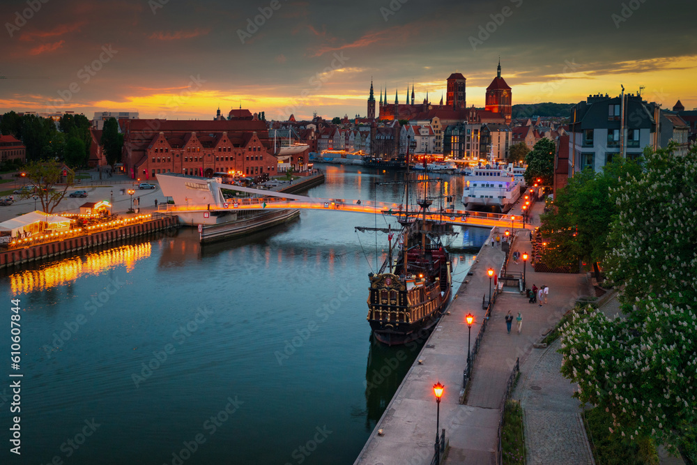 Old town of Gdansk reflected in the Motlawa river at sunset, Poland.