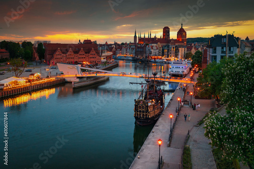 Old town of Gdansk reflected in the Motlawa river at sunset, Poland.