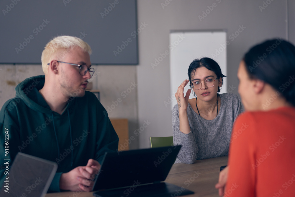 A diverse group of business professionals gathered at a modern office for a productive and inclusive meeting A diverse group of business professionals gathered at a modern office for a productive and inclusive meeting