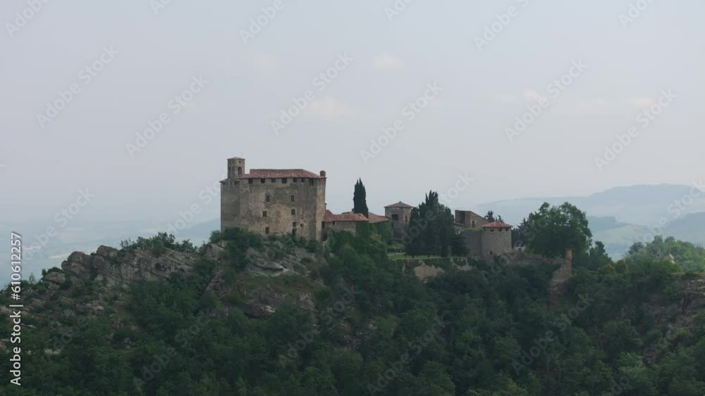 Fortress Rocca Olgisio, Pianello Val Tidone in Italy. Aerial lateral view and sky for copy space Fortress Rocca Olgisio, Pianello Val Tidone in Italy. Aerial lateral view and sky for copy space