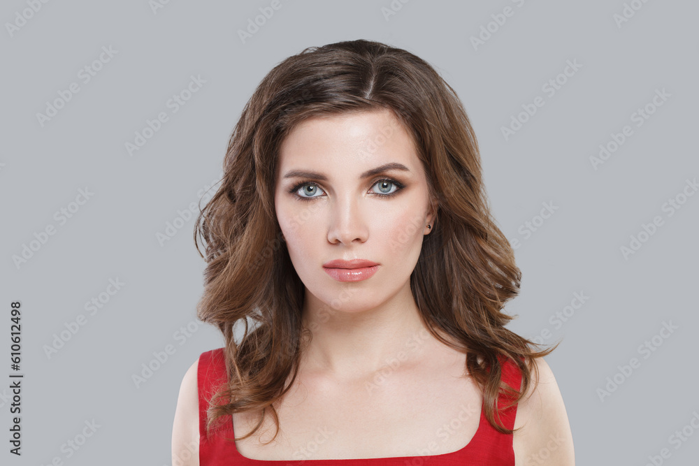 Perfect young brunette woman with makeup and long wavy brown hair on white background Perfect young brunette woman with makeup and long wavy brown hair on white background