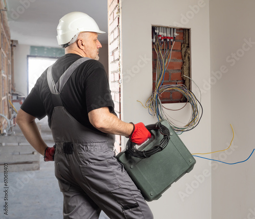 Man electrician. Power shie...