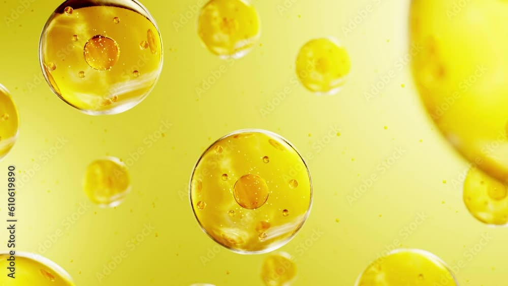 Many essence bubbles in light yellow color with smaller bubbles inside displayed on soft background. 3D concept skin care cosmetics solution
