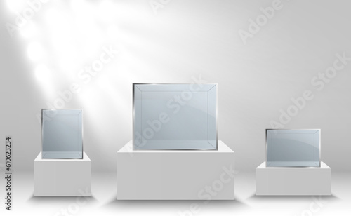 Glass showcase for the exhibition in the form of a cube. Background for sale illuminated by spotlights. Museum glass box isolated advertising or business design boutique. Exhibition hall.
