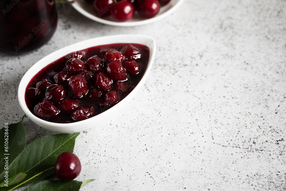 cherry jam and fresh cherries in a bowl, homemade preserves cherry jam and fresh cherries in a bowl, homemade preserves