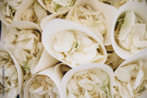 Wedding. Details. White rose petal wrappers for wedding ceremony