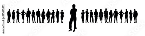 Businesswoman standing in front of group of business team silhouettes.