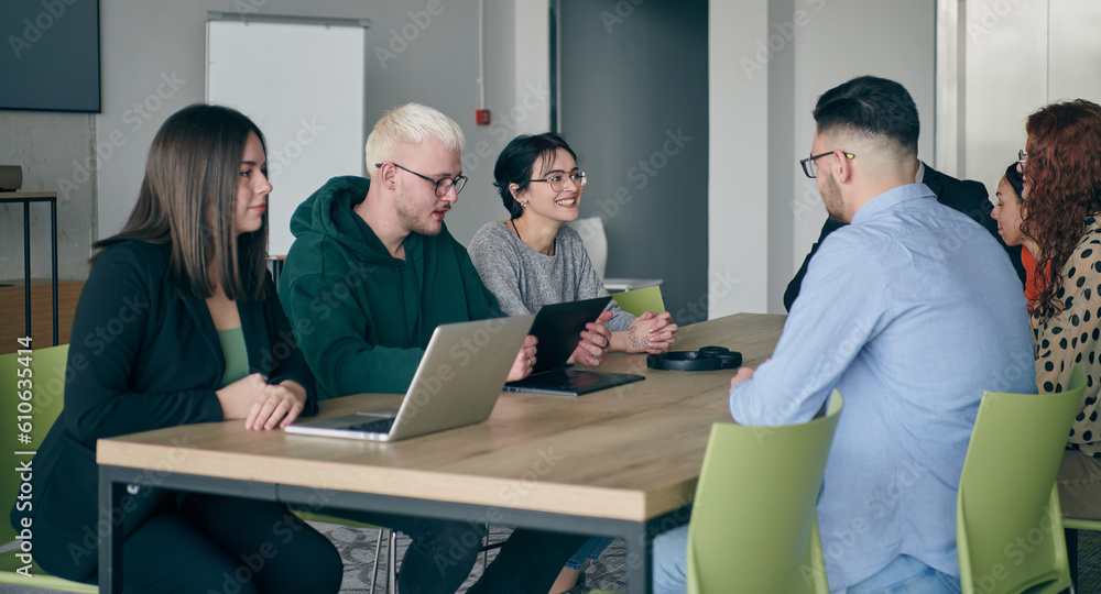 A diverse group of business professionals gathered at a modern office for a productive and inclusive meeting A diverse group of business professionals gathered at a modern office for a productive and inclusive meeting