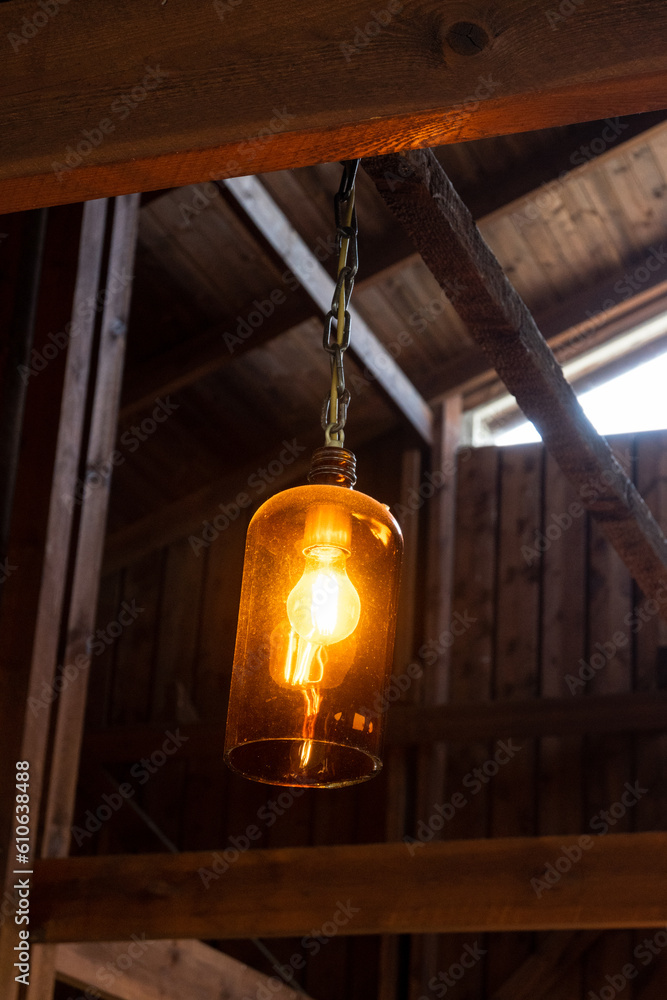 Atmospheric photo of a little lamp inside a coffee shop