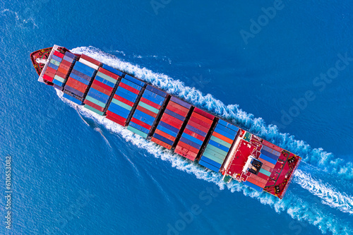 Aerial view ontainer ship in export and import business and logistics. Shipping cargo to harbor. photo