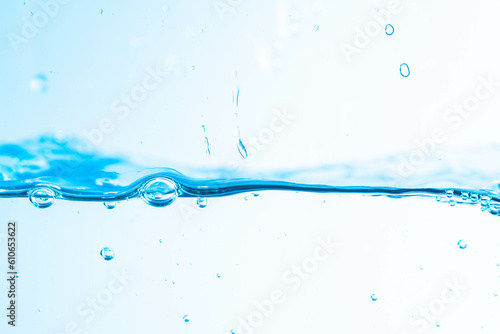Background image of moving water in waves isolated on white background, clear water, water bubbles,macro