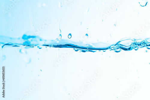 Background image of moving water in waves isolated on white background, clear water, water bubbles,macro