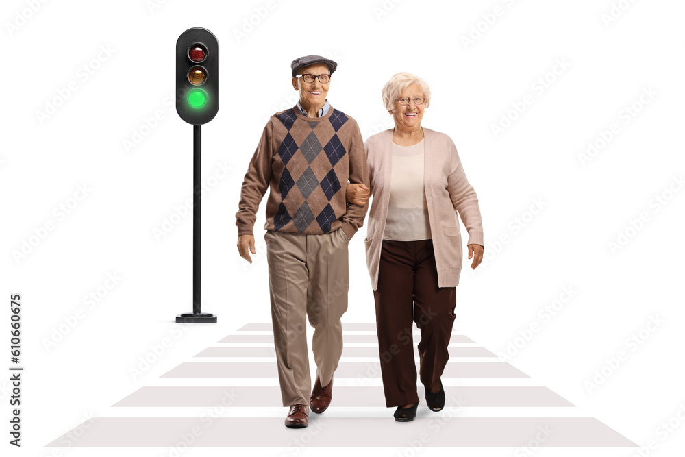 Full length portrait of an elderly couple walking at pedestrian crosswalk Full length portrait of an elderly couple walking at pedestrian crosswalk
