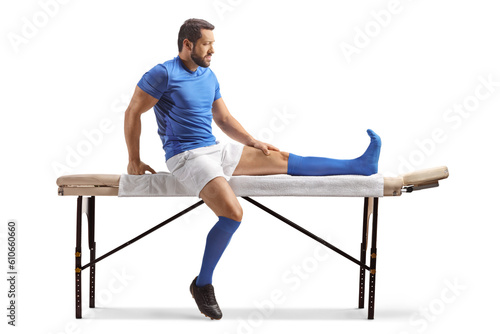 Sports athlete sitting on a therapy table