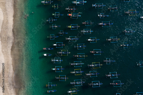 Aerial view of beautiful Papuma beach with traditional boats in Jember, Indonesia photo