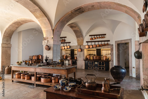 Large antique kitchen with pots