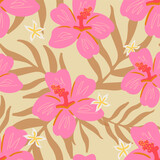 Trendy golden tropical seamless pattern. Pink hibiscus buds on a beige background. Pink and yellow tropical flowers and palm leaves on solid gold