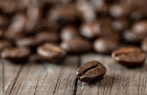coffee beans on old wood for texture background.