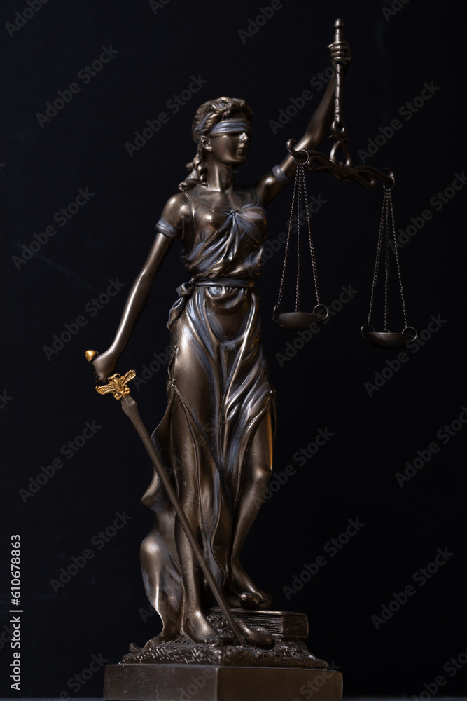 Themis statue and judge gavel in the law faculty library. Themis statue and judge gavel in the law faculty library.