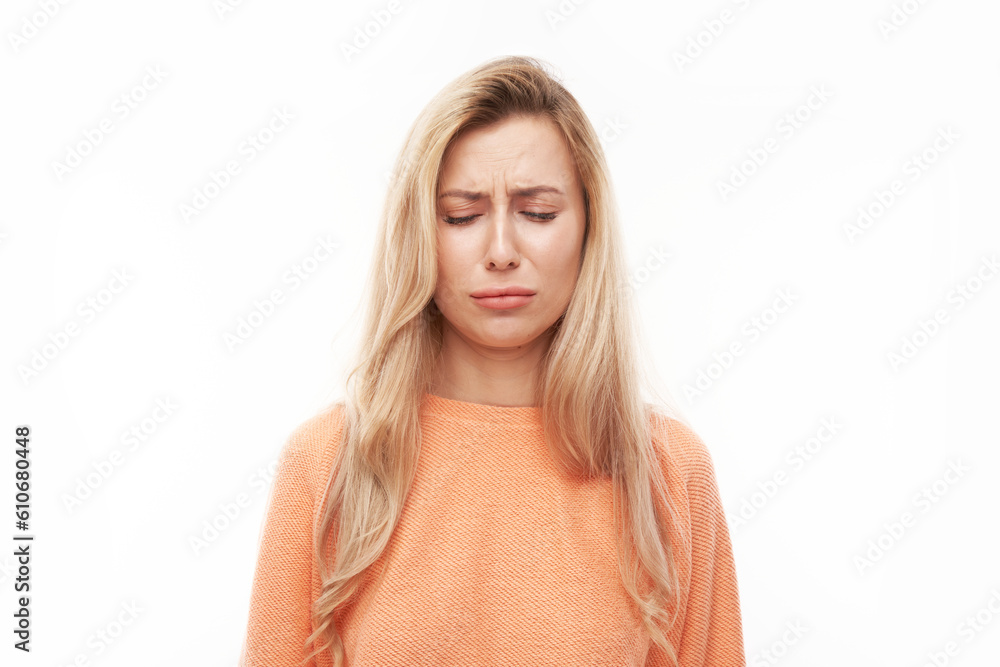 Portrait sad blonde young woman isolated on white studio background. Made mistake, upset and depressed face. Portrait sad blonde young woman isolated on white studio background. Made mistake, upset and depressed face.