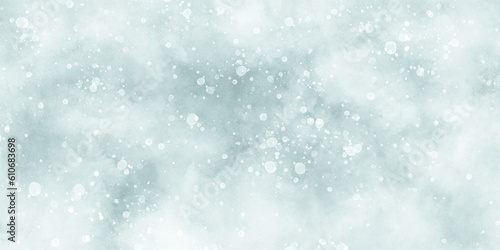 Abstract winter morning shiny white snow is falling randomly with various bokeh particles, beautiful blue watercolor background with glitter particles for wallpaper and design and decoration. © DAIYAN MD TALHA