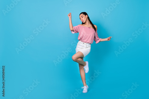 Fototapeta Naklejka Na Ścianę i Meble -  Full length photo of shiny cute lady wear off shoulders red blouse dancing empty space isolated blue color background