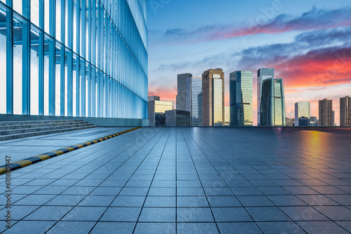 City square and skyline with modern architecture at sunrise