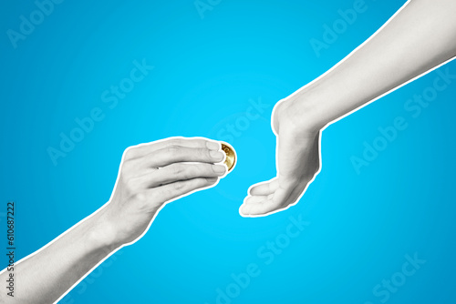 Closeup of a hand giving coin to another hand