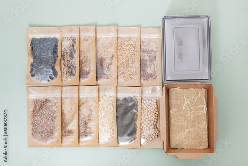 Set for growing sprouts from seeds. Seeds, linen mats, boxes and lids flat lay, top view