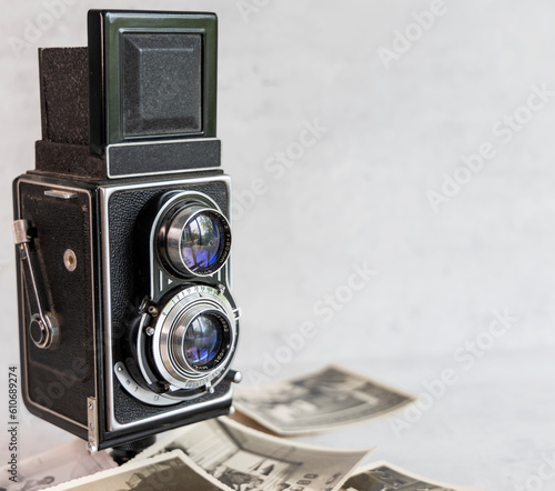 Old twin-lens camera with photos
