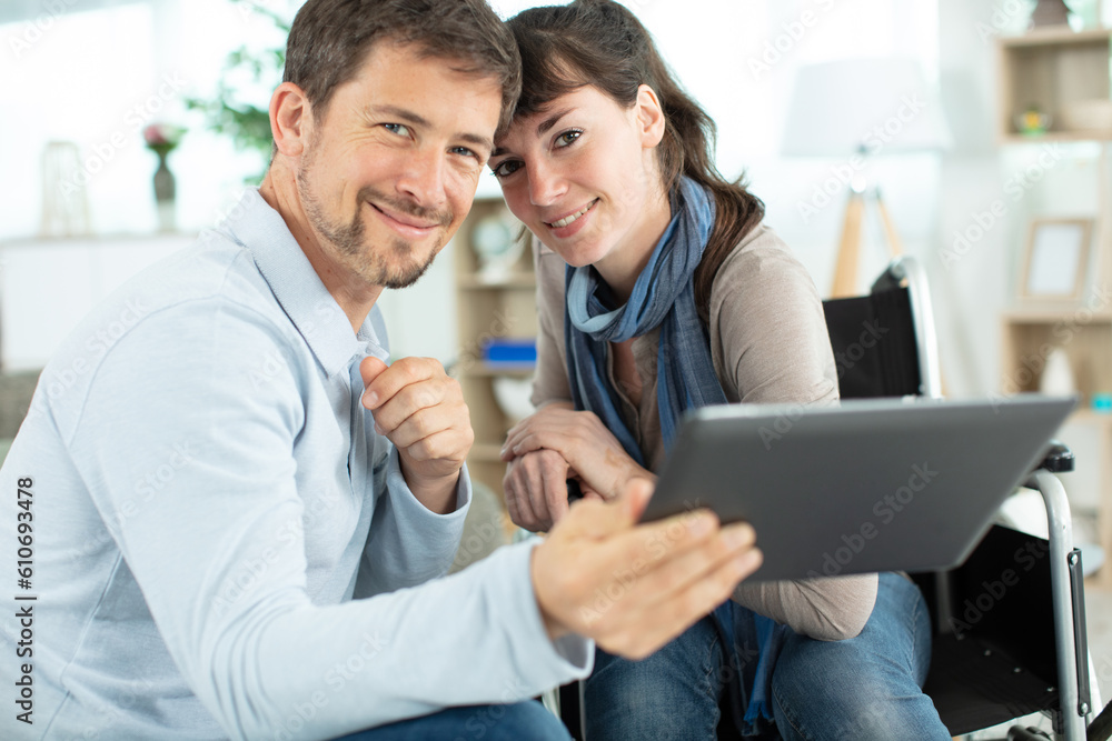 young couple using digital tablet in the kitchen young couple using digital tablet in the kitchen