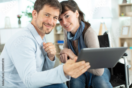 young couple using digital tablet in the kitchen © auremar