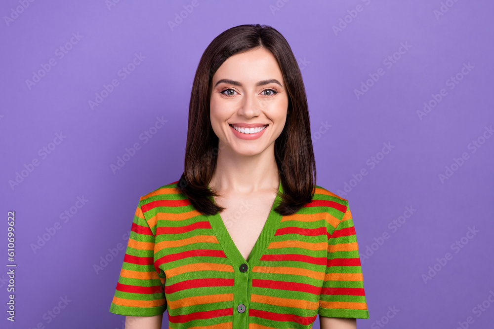 Portrait of gorgeous friendly satisfied girl with stylish hairdo dressed striped cardigan toothy smiling isolated on violet background Portrait of gorgeous friendly satisfied girl with stylish hairdo dressed striped cardigan toothy smiling isolated on violet background