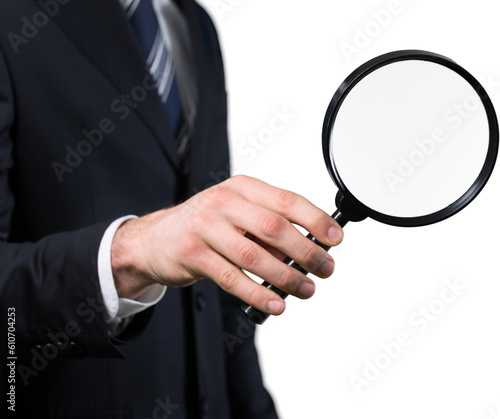 Human resources, business man hand holds magnifying glass