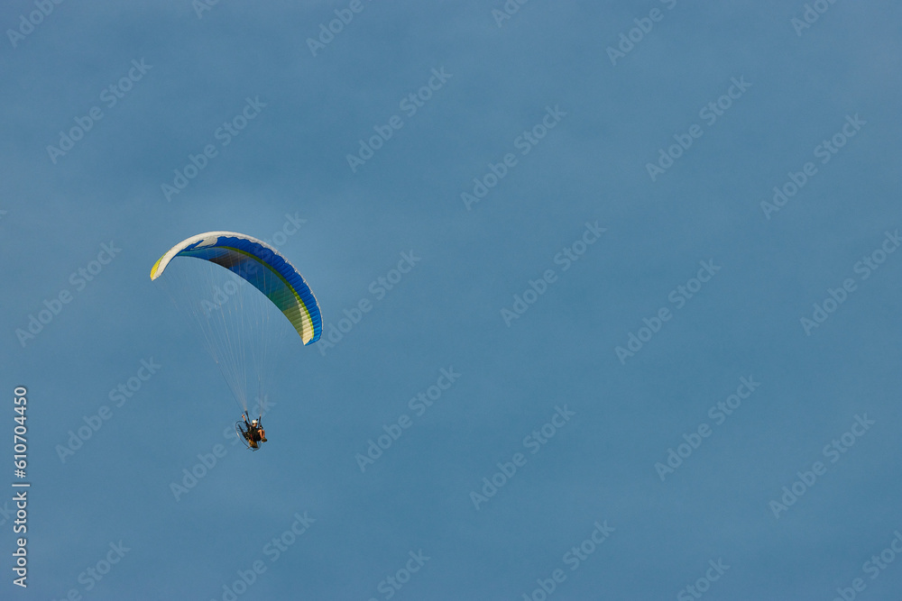 Paraglider flying next to the moon Paraglider flying next to the moon