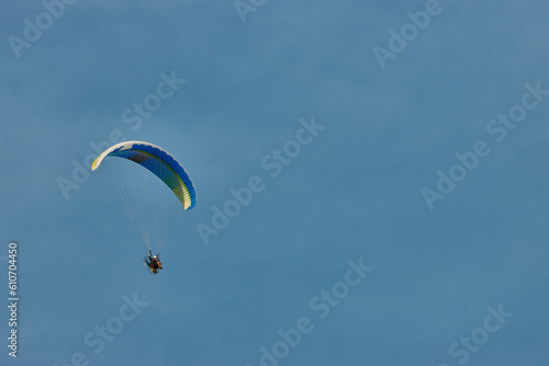 Paraglider flying next to the moon